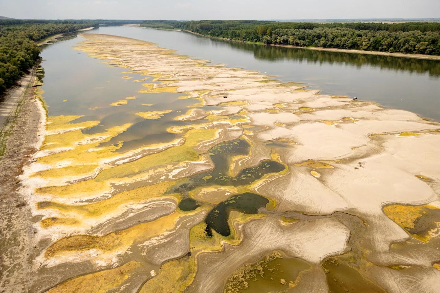 Danube River are exposed amid exceptionally low water levels, in Rasova, Romania, Monday, Aug. 3 2026. (AP Photo/ Vadim Ghirda)